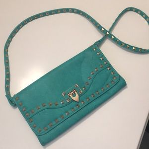 Teal blue purse with gold studs
